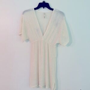 Women’s size medium swimsuit cover-up color is ivory